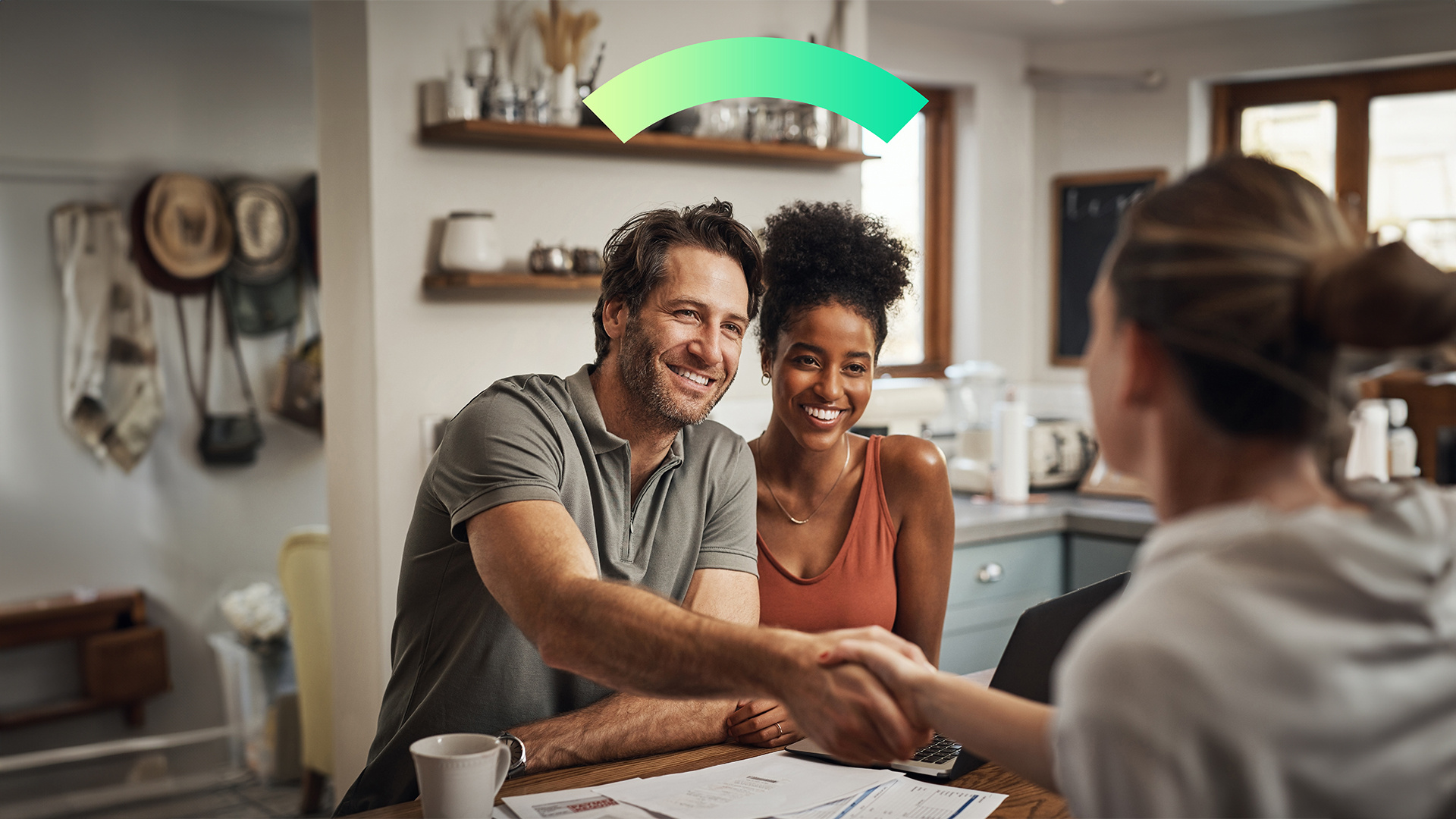 Insurance advisor explains offerings to young couple in new house. They're Covered.