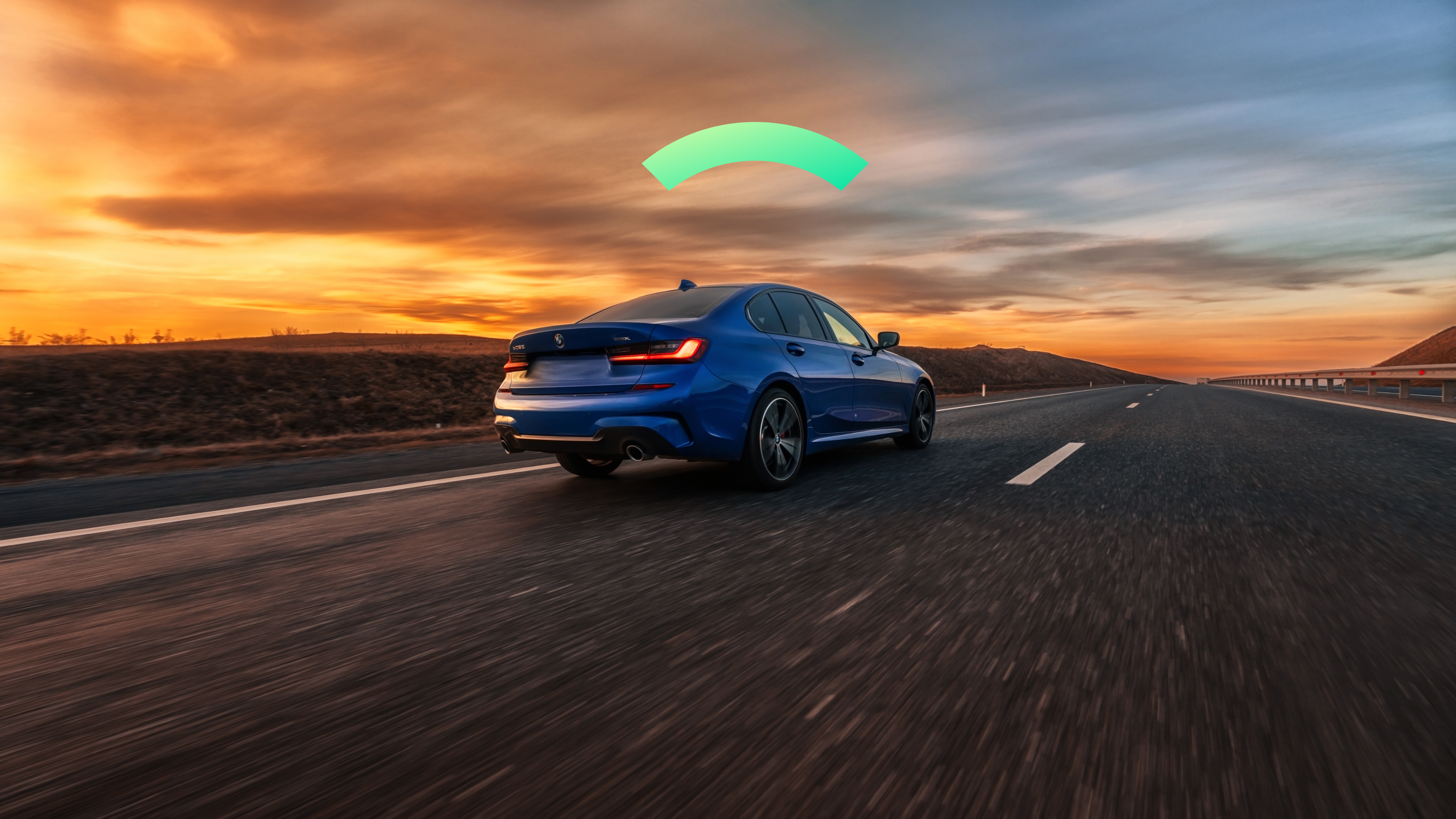 A car drives on a highway at sunset. It's Covered.